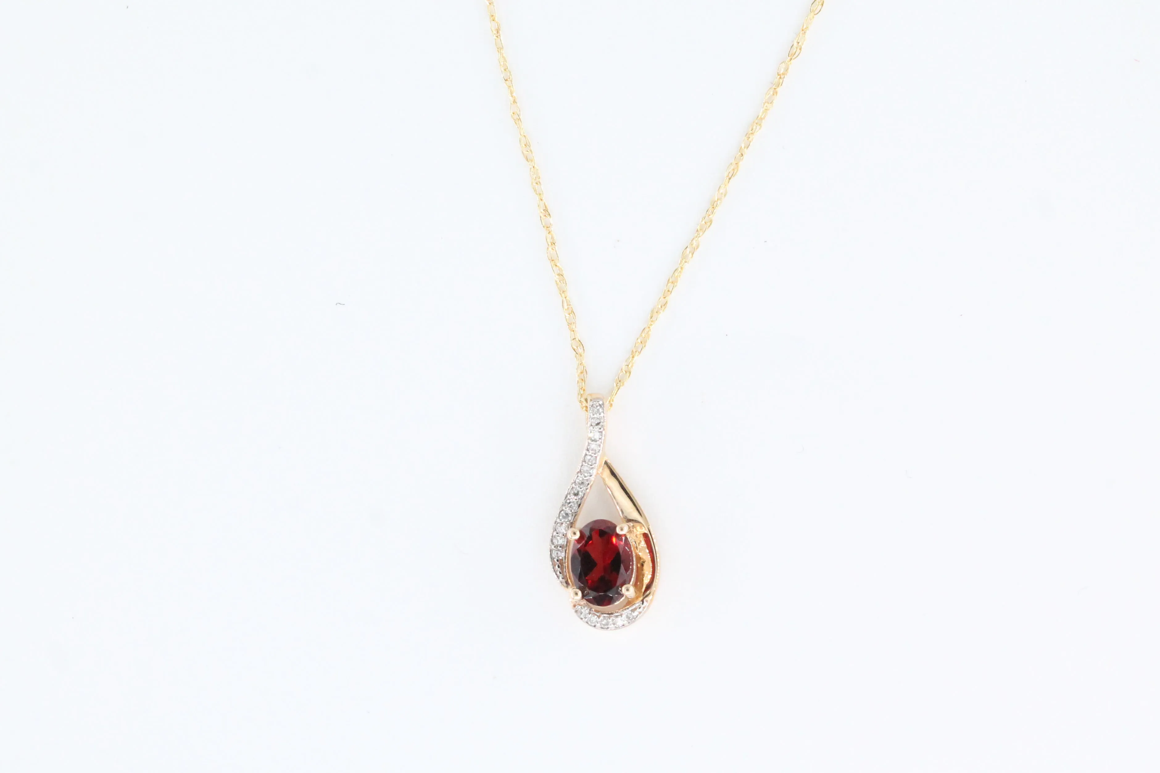 Yellow Gold Garnet and Diamonds Twist Pendant with Chain